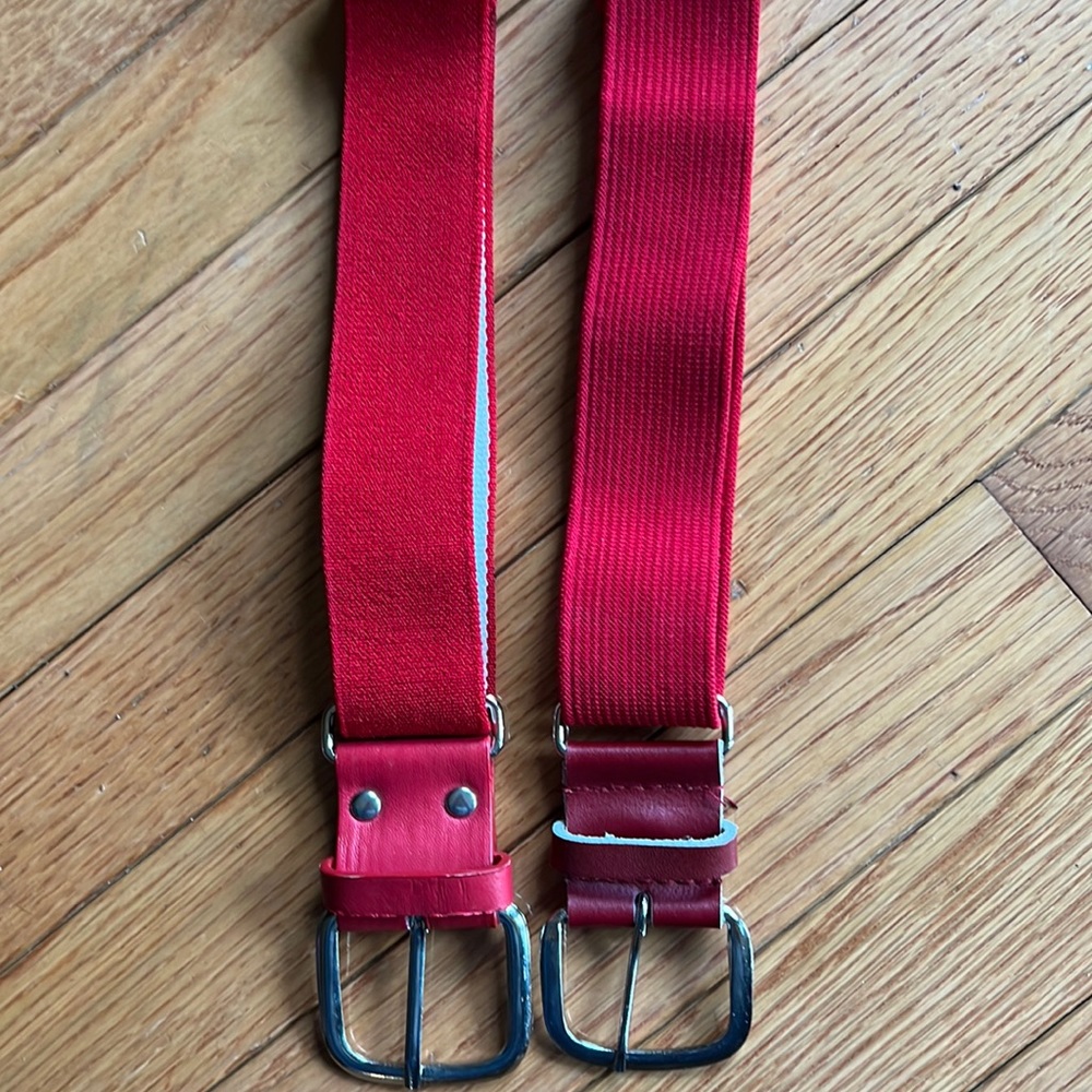 TWO red adjustable baseball belts